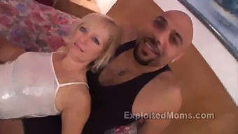 A Middle-Aged Blonde Woman Engages In Sexual Activity With An Inexperienced Partner Who Possesses A Large Black Penis, As Captured In A Steamy Video